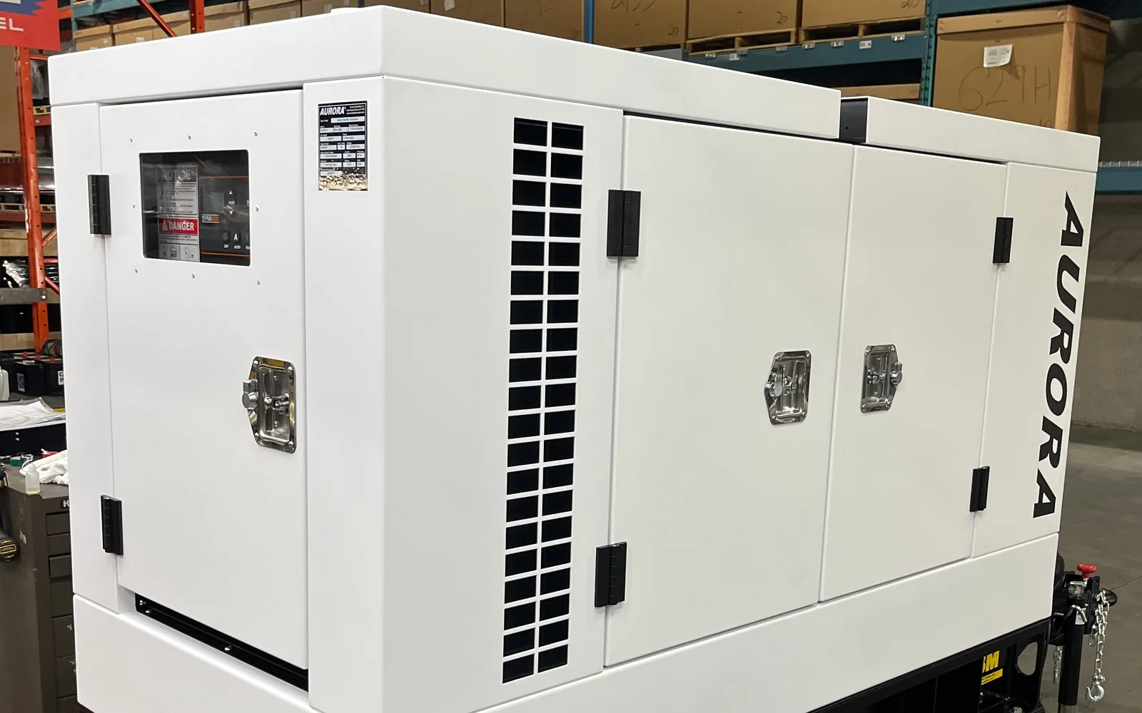 Towable diesel generator set on a single-axle trailer in a sound-attenuating canopy