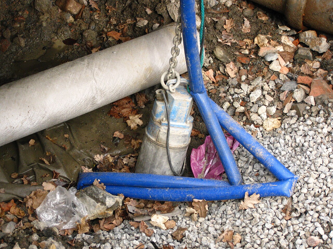 A submersible pump draining a ditch